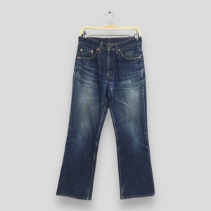 Talla 28x27 Vaqueros acampanados Levi&#39;s 517 vintage con corte de bota, denim lavado claro, vaqueros Levi&#39;s lavados a la piedra de los años 90, vaqueros Levi&#39;s desgastados, vaqueros Levi&#39;s con cremallera W28