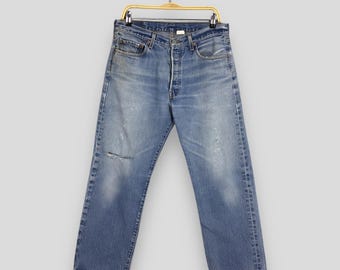 Jeans Levi's 501 vintage anni 2000 in denim con patta e bottoni, jeans Levi's 501 stonewashed, jeans Levi's sbiaditi, taglia 31x26,5