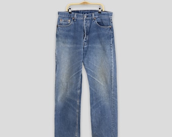 Vintage 80s Levi's 501 Jeans: Ripped Denim, Made in USA (W32 L32.5