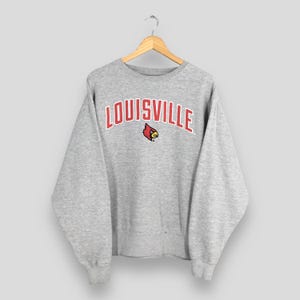 Bluza futbolowa Louisville Cardinals z lat 90. XX wieku w rozmiarze XL z haftowanym logo Louisville, okrągłym dekoltem, sweter University of Louisville Apparel w rozmiarze XL