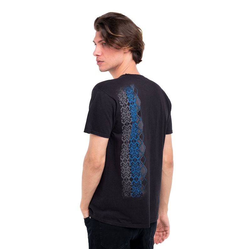 May include: Black t-shirt with a blue and gray patterned design on the back.