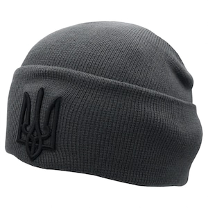May include: A gray knitted beanie with a black embroidered Ukrainian trident symbol.