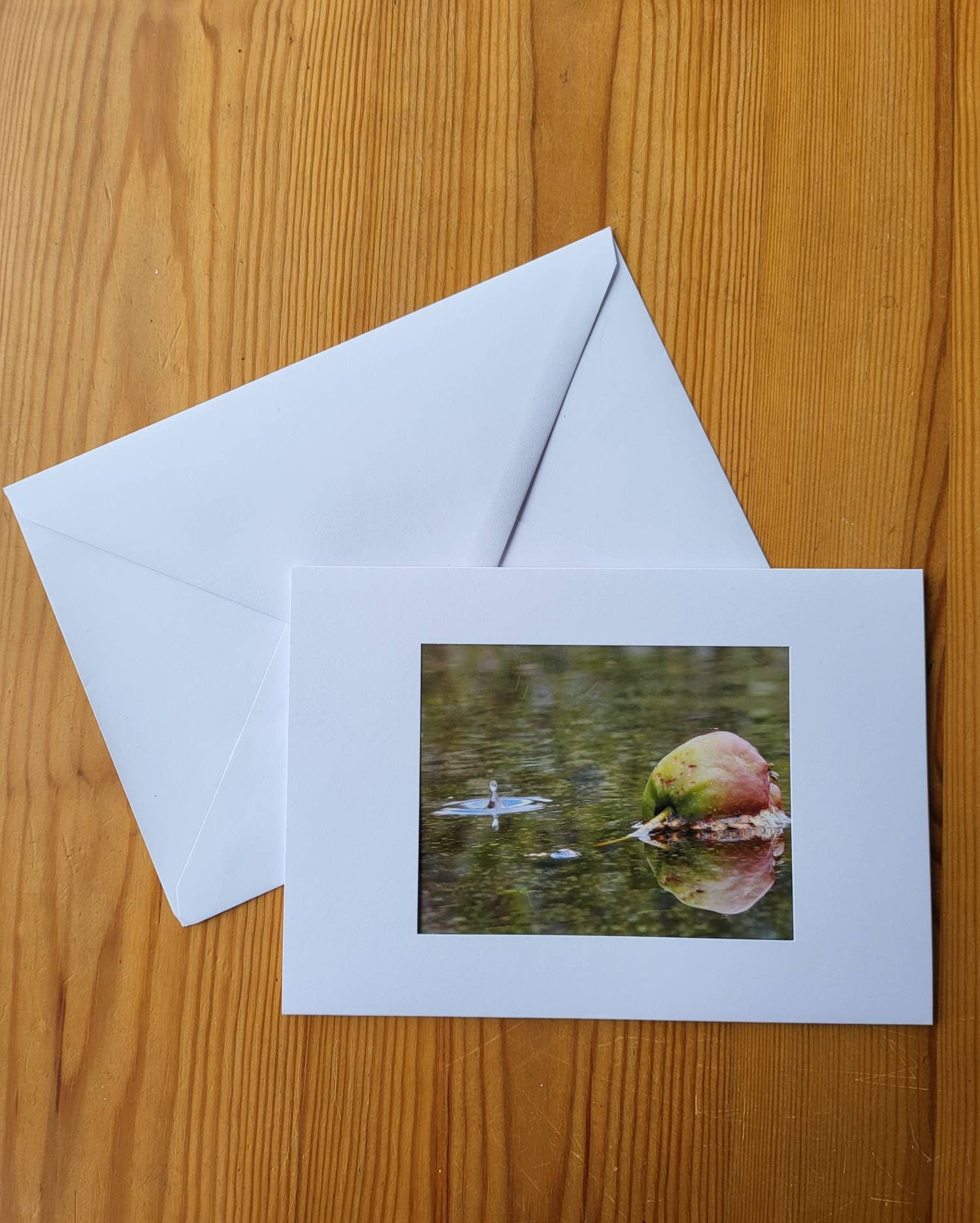 notelet ripples in puddle Greetings card water drop apple with reflection blank inside for your message. notelet ripples in puddle Greetings card water drop apple with reflection blank inside for your message.
