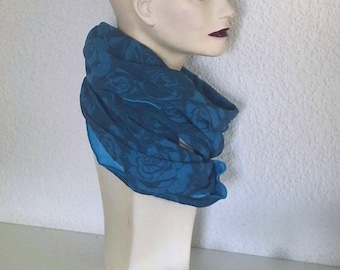 Set of loop scarf and leg warmers in petrol blue with turquoise rose pattern