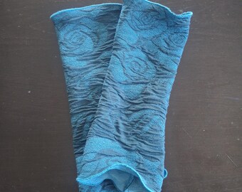 Cuffs, arm warmers, wrist warmers made of cloque jersey in petrol with turquoise roses