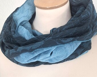 Loop made of cloque jersey in petrol with turquoise rose pattern