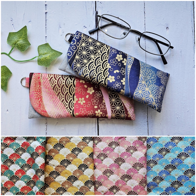 May include: Three fabric eyeglass cases with Japanese-inspired patterns. The cases are blue, red, and pink with gold accents. The patterns include flowers, waves, and geometric shapes.