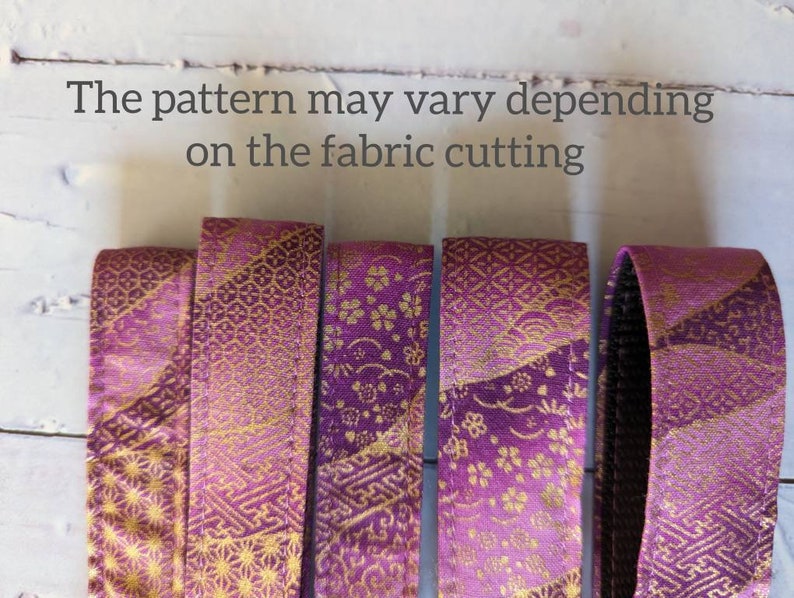 May include: Five strips of purple fabric with a gold pattern. The pattern may vary depending on the fabric cutting.