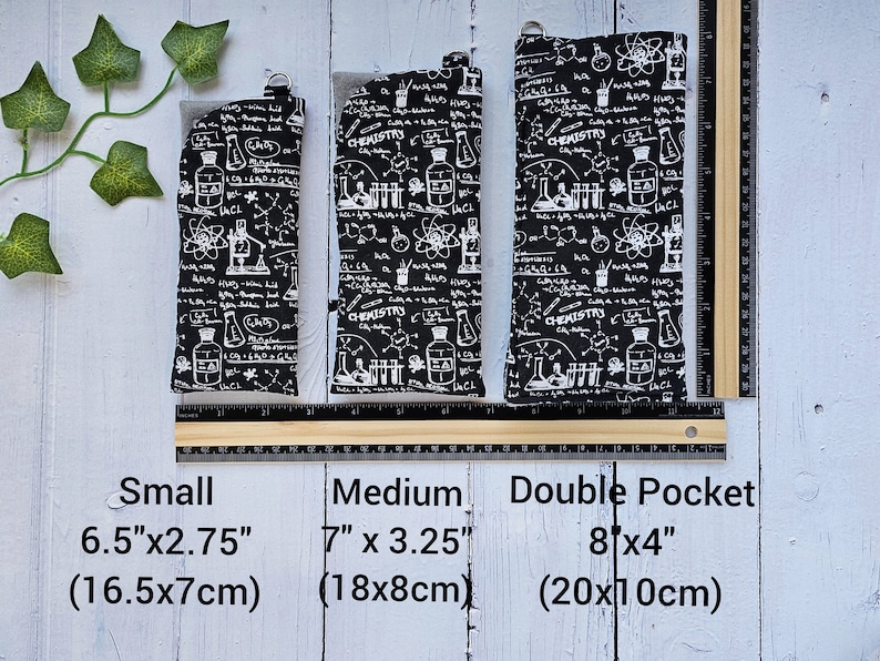 May include: Three black fabric pouches with a white chemistry print. The pouches are labeled "Small 6.5"x2.75" (16.5x7cm)", "Medium 7"x3.25" (18x8cm)", and "Double Pocket 8x4" (20x10cm)".