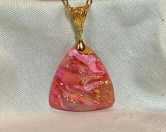 Polymer clay and resin “pink passion” pendant.