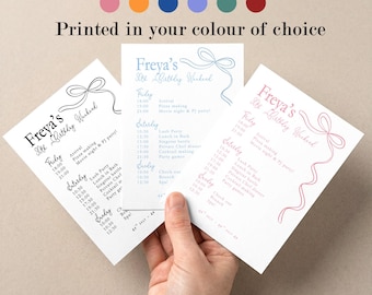 May include: Three invitation cards with a birthday weekend schedule, featuring a bow design and the text "Freya's 30th Birthday Weekend." The cards are in black, blue, and pink, with the text "Printed in your colour of choice."