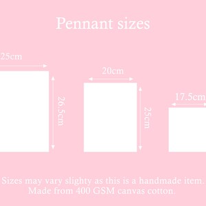 May include: Diagram showing three different sizes of pennants. The pennants are white and measure 25cm x 26.5cm, 20cm x 25cm, and 17.5cm x 16.5cm. The text "Pennant sizes" is at the top of the diagram. The text "Sizes may vary slightly as this is a handmade item. Made from 400 GSM canvas cotton." is at the bottom of the diagram.
