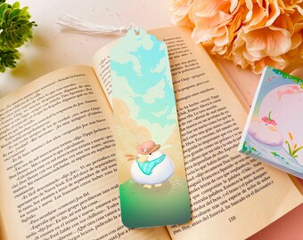 May include: A colorful bookmark featuring a cartoon chicken wearing a hat and holding a paintbrush. The bookmark has a blue sky and green grass background. The text "Tippy Jackson" is visible on the bookmark.
