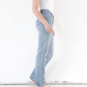 Vintage Levis 501 W26 W27 90s Denim Made in Poland Distressed Faded Light Wash Jeans