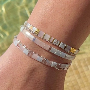 close up image of the vanilla blush stack set of 3 tila bead bracelet on a wrist











VANILLA BLUSH - Tila Bead Bracelet Stack Set of 3 | Modern Stretch Beaded Bracelets | Waterproof Miyuki Bracelets for Women, Gift for Mates