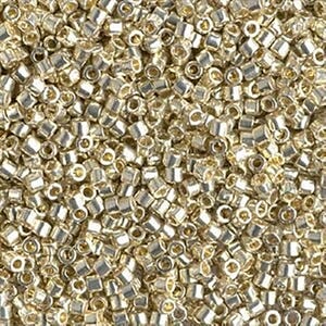May include: A close-up view of a large quantity of silver-colored seed beads. The beads are small and round, with a hole in the center. They are perfect for jewelry making or other craft projects.
