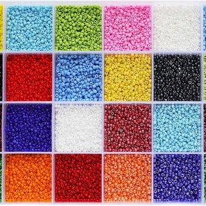 a bunch of different colors of beads