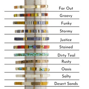 a stack of bracelets with different colors and sizes