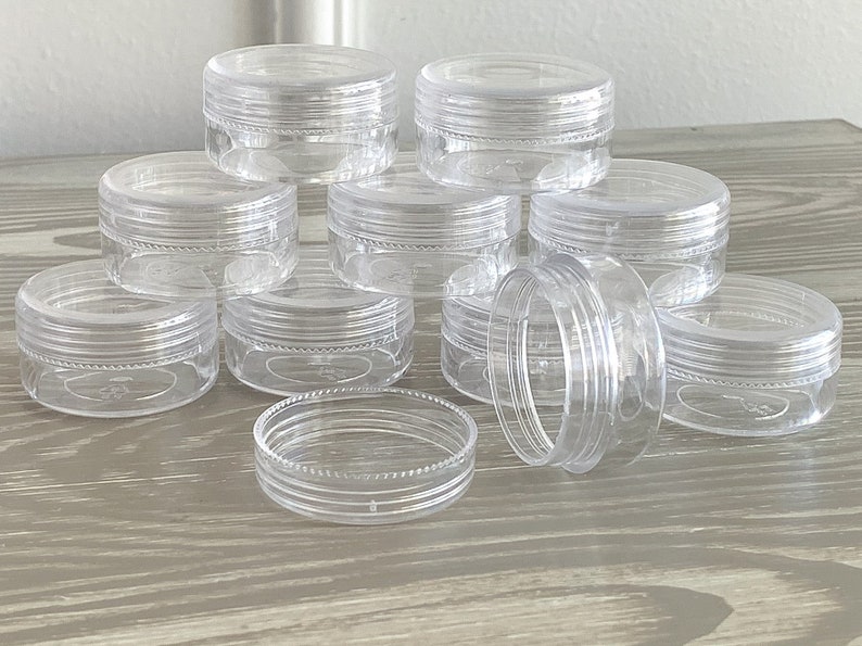image of the Round Bead Containers 25-Pack on a table. 






Round Bead Containers 25-Pack | Clear Plastic Storage Jars with Twist Lids, 1.5 Inch Diameter Bead Storage Box for Jewelry & DIY Craft Kits