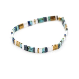 a blue and white beaded bracelet on a white background













Shoreline Mix & Match Tila Bead Bracelets for Women | High Quality Stacking Bracelet | Boho Stretch Bracelet | Waterproof Miyuki Tila Beads