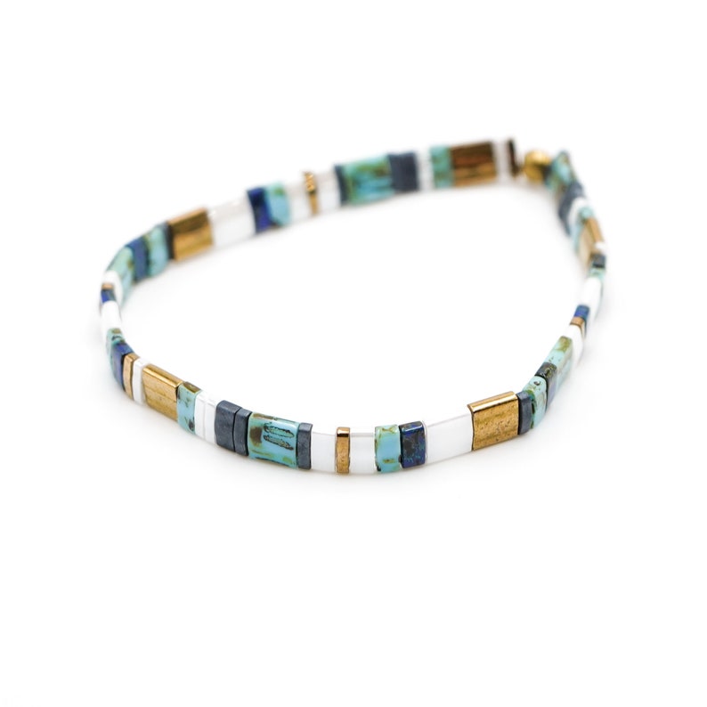 a blue and white beaded bracelet on a white background













Shoreline Mix & Match Tila Bead Bracelets for Women | High Quality Stacking Bracelet | Boho Stretch Bracelet | Waterproof Miyuki Tila Beads