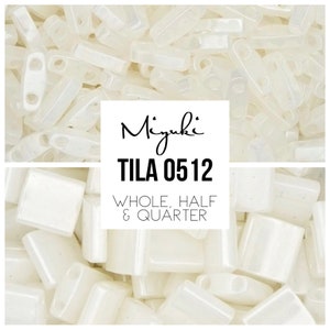 May include: A close-up image of white opaque seed beads in various sizes. The beads are in a pile and some are partially overlapping. The text "Miyuki TILA 0512 WHOLE, HALF & QUARTER" is visible in the image.