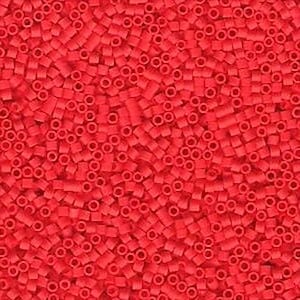 May include: A large quantity of small, red plastic beads. The beads are cylindrical with a hole in the center.