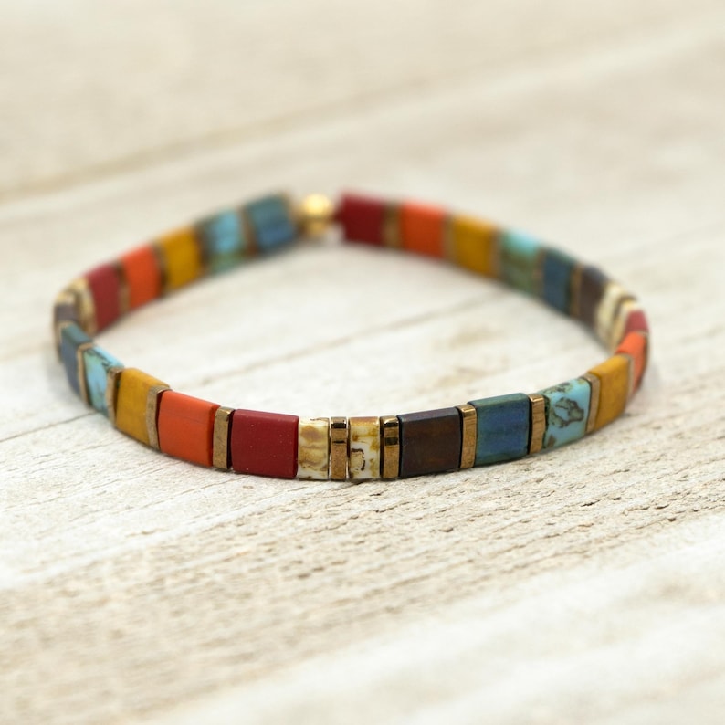image of the STAINED Handmade Bracelet on a concrete surface








STAINED Handmade Bracelet | Bohemian Tila Bracelet | Waterproof Beaded Bracelet | Comfortable Stretch Bracelet | Mack and Rex Jewelry