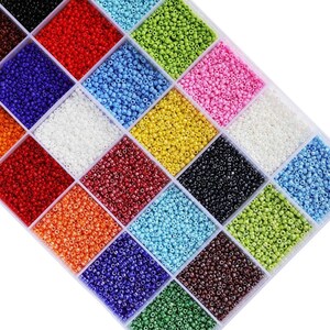 a box filled with lots of different colors of beads