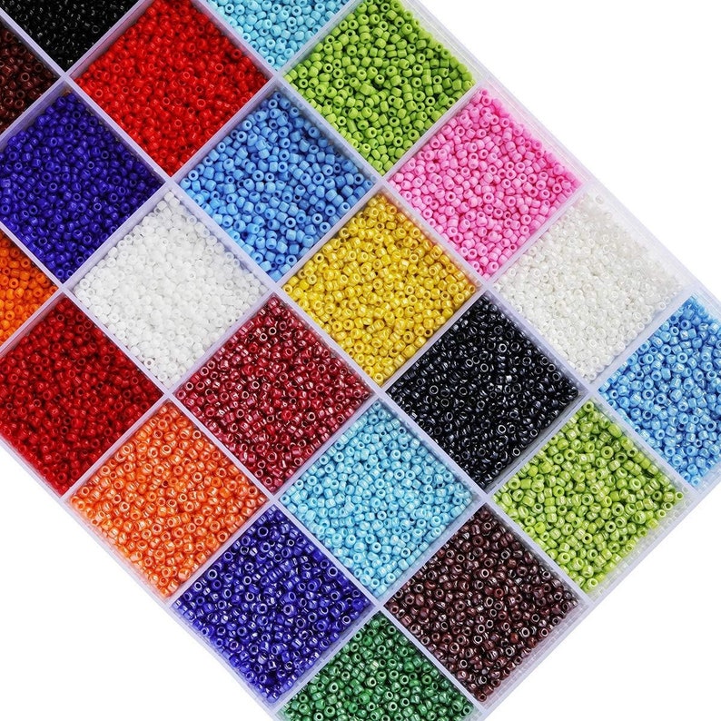 a box filled with lots of different colors of beads