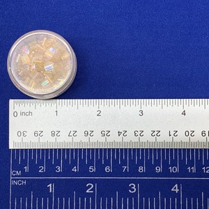 an image of the image of the Round Bead Containers 25-Pack being measured with a ruler. 








Round Bead Containers 25-Pack | Clear Plastic Storage Jars with Twist Lids, 1.5 Inch Diameter Bead Storage Box for Jewelry & DIY Craft Kits