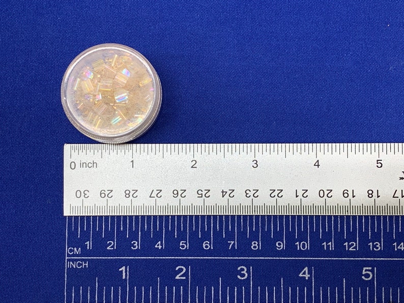 an image of the image of the Round Bead Containers 25-Pack being measured with a ruler. 








Round Bead Containers 25-Pack | Clear Plastic Storage Jars with Twist Lids, 1.5 Inch Diameter Bead Storage Box for Jewelry & DIY Craft Kits