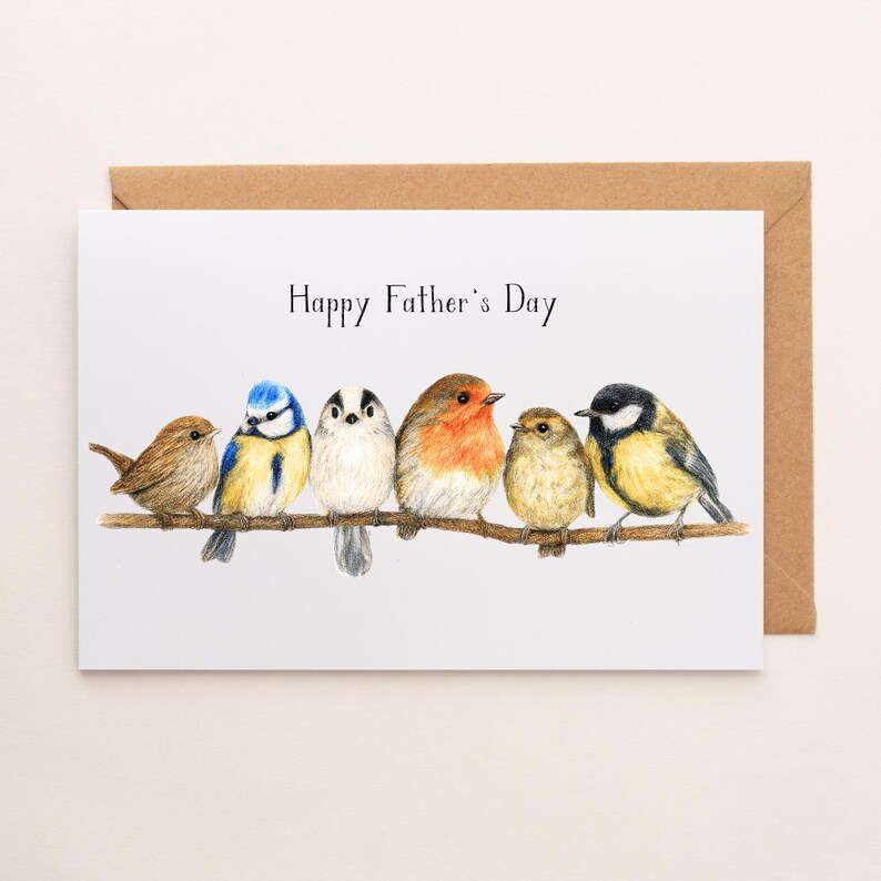 May include: A Father's Day card with a brown envelope. The card features a watercolour illustration of six birds of different colours perched on a branch, with the text "Happy Father's Day" above.