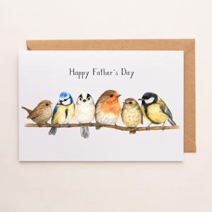 May include: A Father's Day card with a brown envelope. The card shows a watercolour illustration of six birds of different colours perched on a branch. The words "Happy Father's Day" are written above.