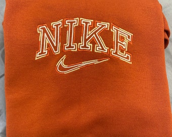 orange nike sweaters