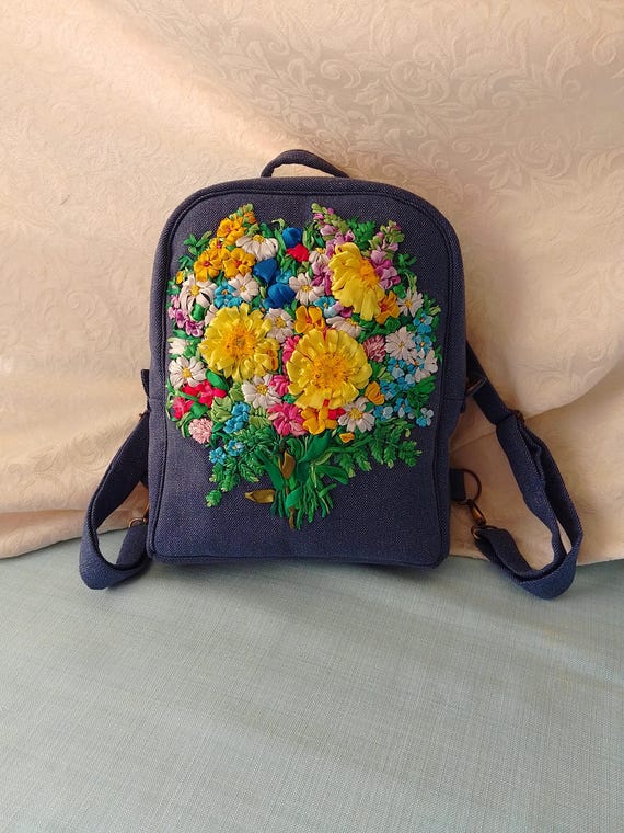 Handmade Embroidered Denim Backpack With Sunflowers in a  display picture 1