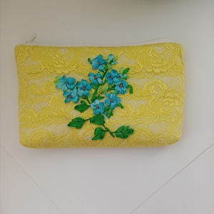 Handmade cosmetic mini bag made of yellow lace with embroidered "Forget-me-not" flowers. Embroidered wallet. Gift