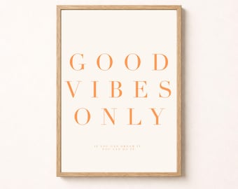 May include: A rectangular wall art print in a light wood frame featuring the orange text GOOD VIBES ONLY in a serif font. Below the main text, smaller orange text reads IF YOU CAN DREAM IT, YOU CAN DO IT. The background is a solid off-white color.