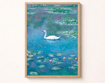 May include: A framed wall art print featuring an impressionist-style painting of a white swan swimming in a vibrant blue pond filled with green lily pads and small pink flowers, enclosed in a light-colored wooden frame with a thin border.