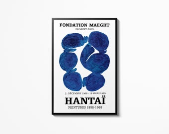 May include: A black and white poster with blue abstract shapes in the center. The poster advertises an exhibition of paintings by Hantaï at the Fondation Maeght in Saint-Paul, France. The exhibition dates are December 21, 1968 to March 16, 1969. The text on the poster reads "Fondation Maeght, 06 Saint-Paul, 21 Décembre 1968 - 16 Mars 1969, Hantaï, Peintures 1958-1968."