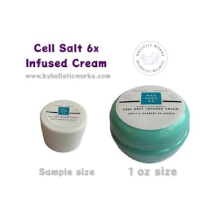May include: Two containers of Cell Salt 6x Infused Cream. One is a sample size, the other is a 1 oz size. The larger container is teal with a white lid. The text on the lid reads "MAG PHOS 6X CELL SALT INFUSED CREAM APPLY & MASSAGE AS NEEDED".