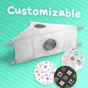 May include: A light gray, plush, triangular pet bed with two circular openings and the word "Customizable" in white. Three circular fabric samples with colorful patterns are shown below the bed, including stars, animals, and geometric designs.