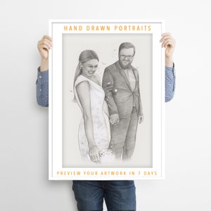 May include: A framed pencil sketch of a couple holding hands, likely a wedding portrait. The artwork is in a white frame, with the text "HAND DRAWN PORTRAITS" and "PREVIEW YOUR ARTWORK IN 7 DAYS" in orange. The couple is dressed in formal attire.