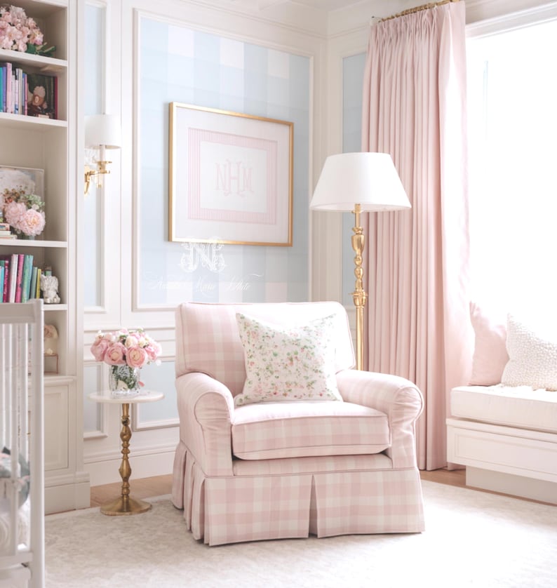May include: A light pink and white plaid upholstered armchair with a pleated skirt and a floral patterned throw pillow. The chair is positioned in a room with light blue and white checkered wallpaper, a gold floor lamp, and a small side table.