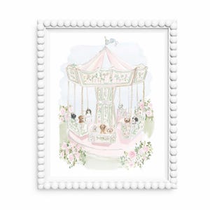 May include: A framed watercolour print depicting a carousel with dogs. The carousel is pink and white with floral details. Pink roses and greenery surround the base. The frame is white with a beaded edge.