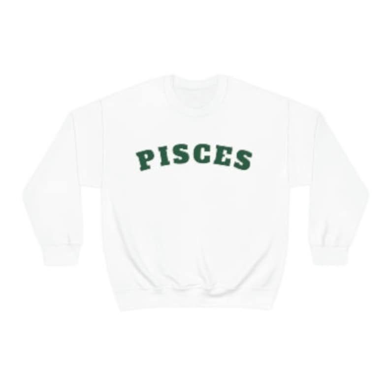 May include: White sweatshirt with a green "Pisces" graphic printed on the front.
