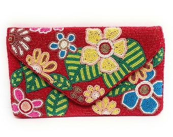 May include: A red beaded clutch with a floral design. The flowers are yellow, pink, blue, and green.