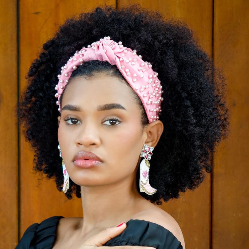 Playful pink western boot dangle earrings adorned with seed beads, rhinestones, and crystal flower stud posts.