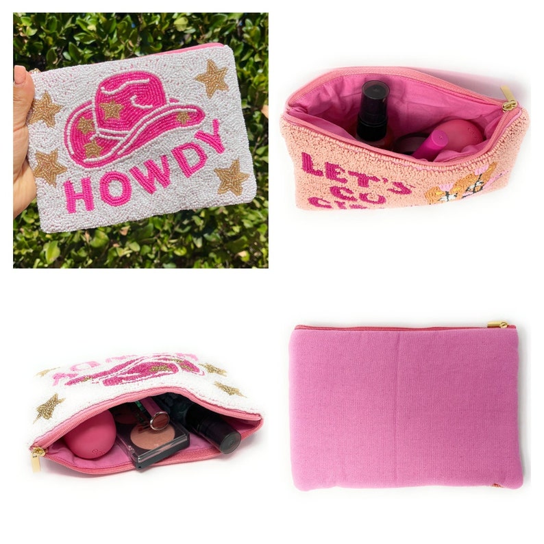 May include: A pink and white beaded cosmetic bag with a pink cowboy hat and the word "HOWDY" in pink letters. The bag is open and shows a pink interior with a zipper closure.