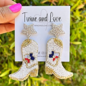 Close-up of a woman wearing stylish boot-shaped earrings with a star accent.